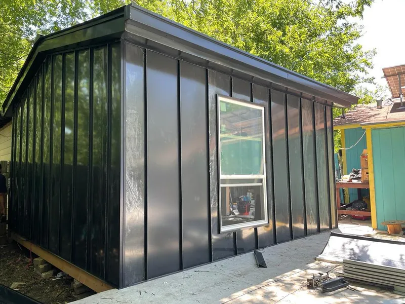 Black standing seam metal wall panels for Roof Inspection in Independence